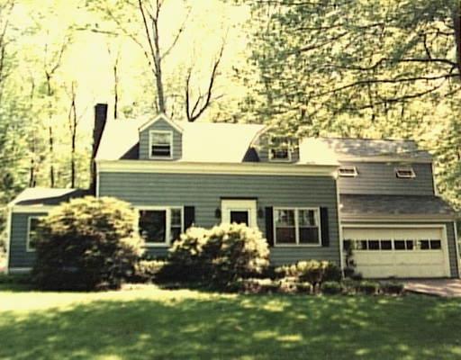 601 Den Road Stamford, CT 06903 - Photo 1 of 1 front view of a house with a yard