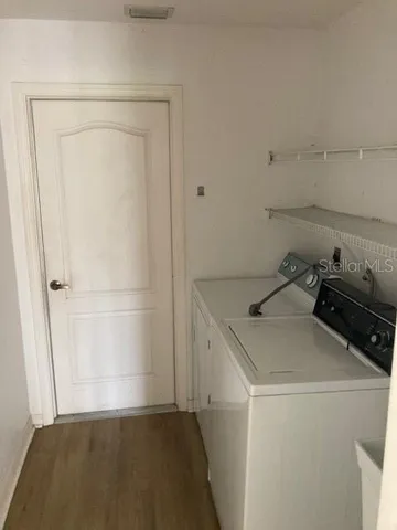 a utility room with dryer and washer