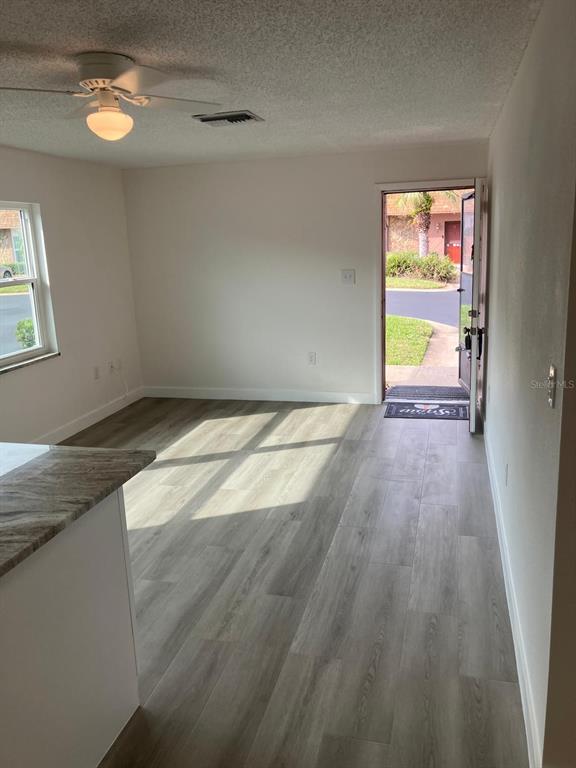6125 Chesham Drive, Unit 1 New Port Richey, FL 34653 - Photo 18 of 39 a view of an empty room and a window