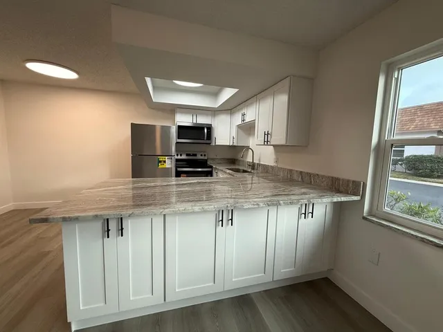 a bathroom with a toilet sink and a mirror