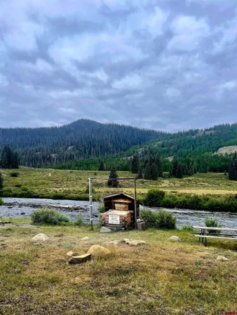 a view of a lake with a yard