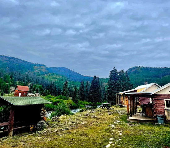 a backyard of a house with yard barbeque oven and outdoor seating