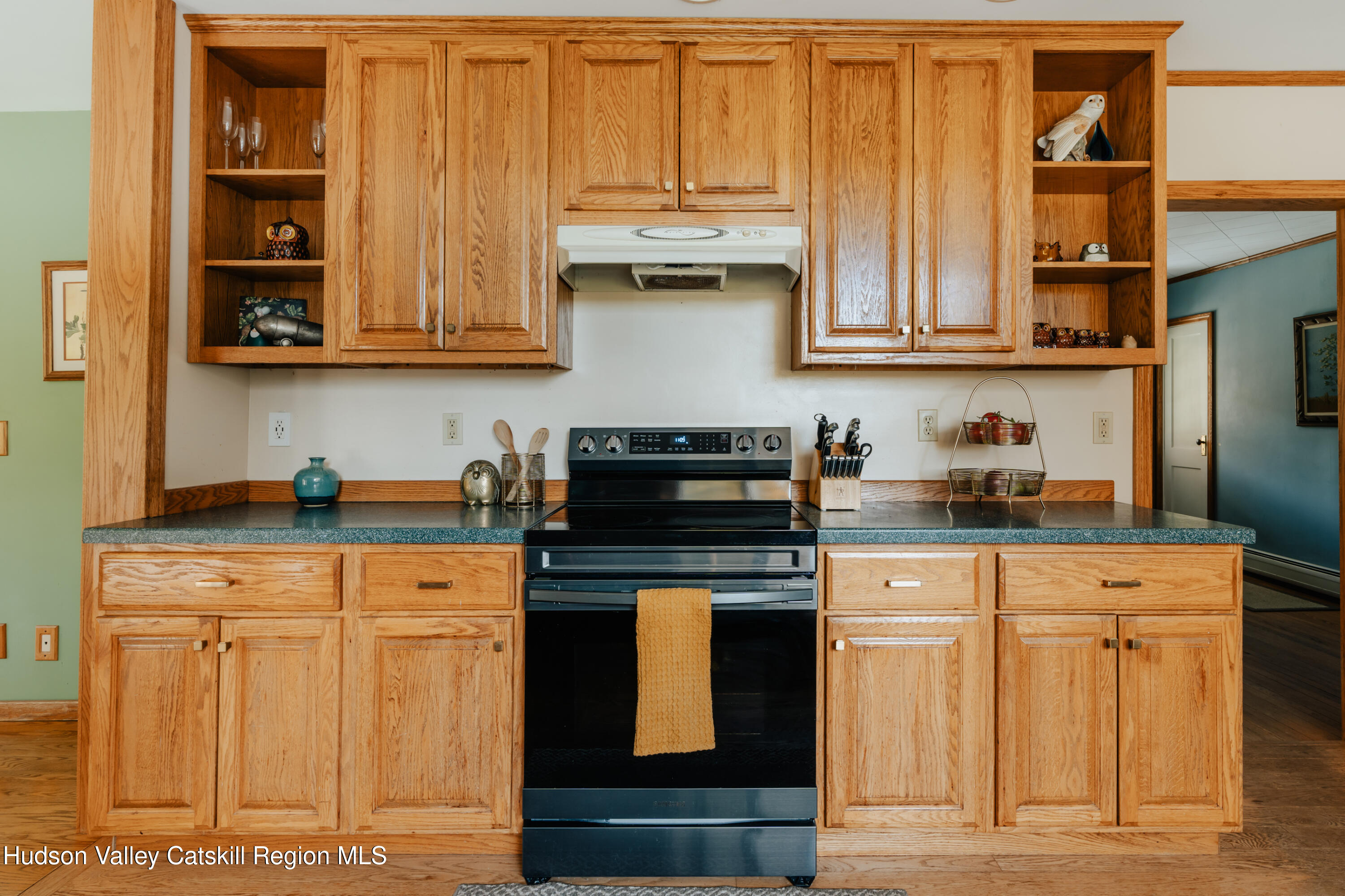 782-784 Jackson Corners Road Red Hook, NY 12571 - Photo 21 of 63 a kitchen with stainless steel appliances granite countertop a stove and a white cabinets