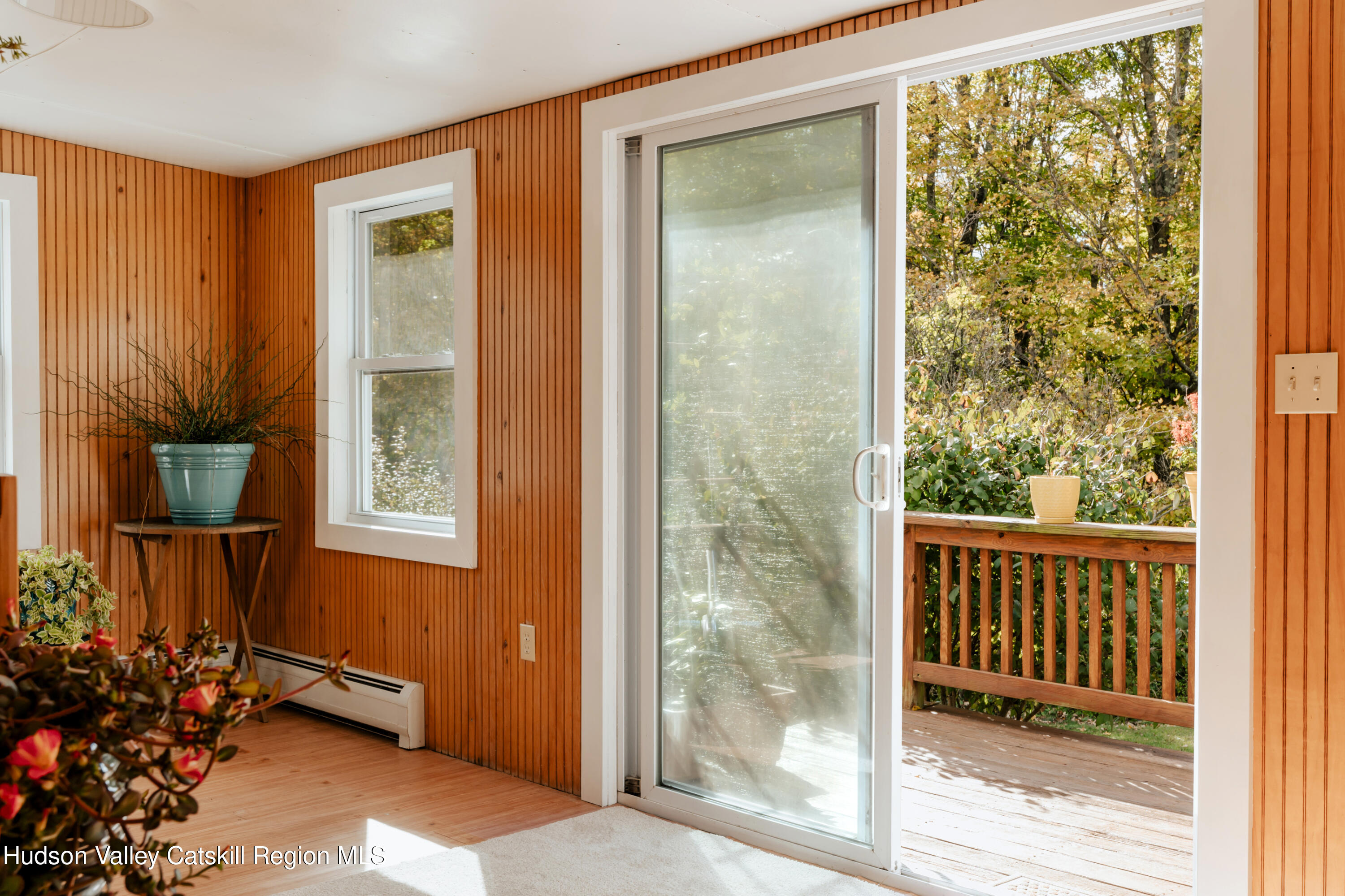 782-784 Jackson Corners Road Red Hook, NY 12571 - Photo 27 of 63 a view of a porch with a door and chair