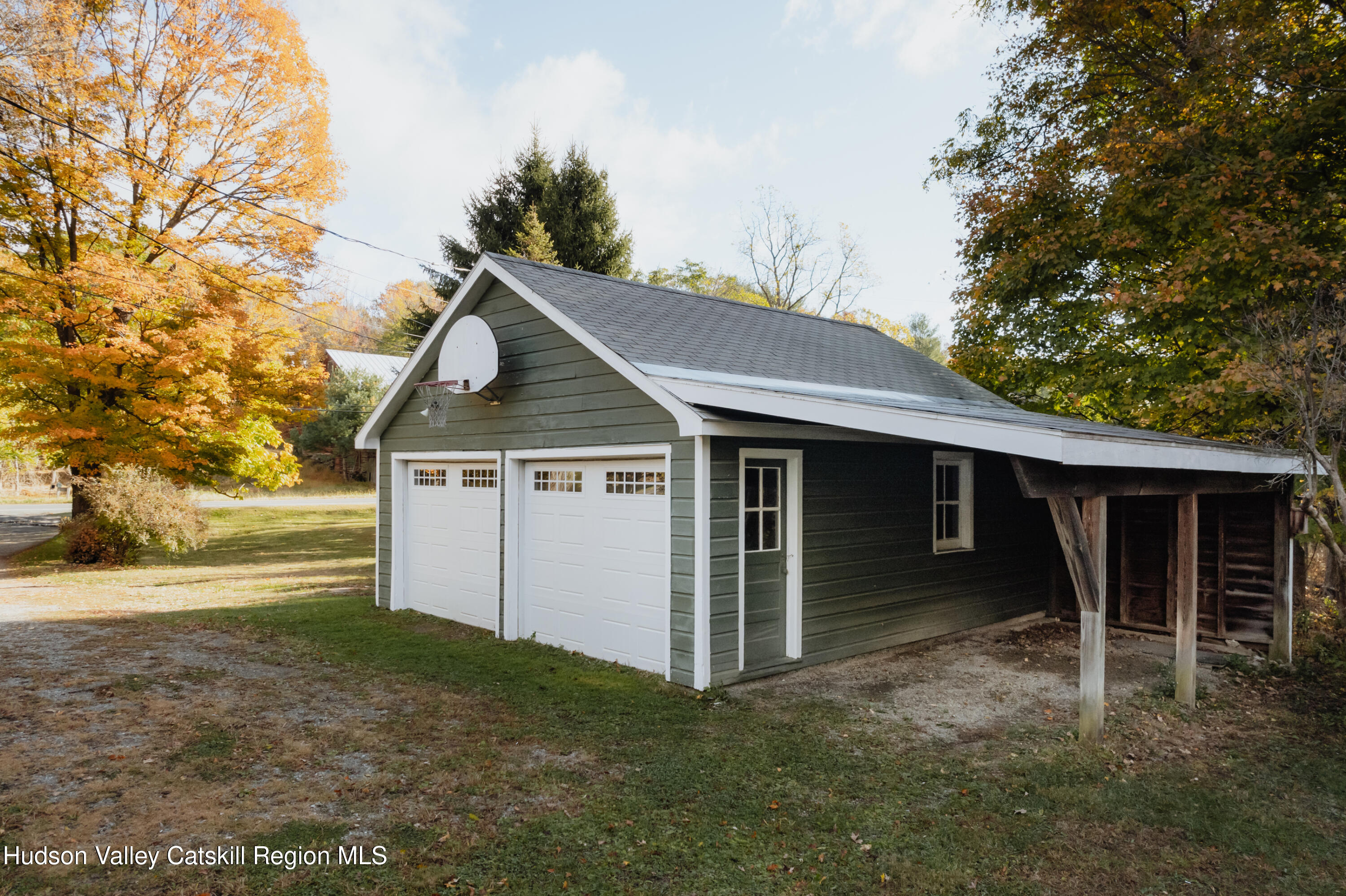782-784 Jackson Corners Road Red Hook, NY 12571 - Photo 53 of 63 a front view of house with yard and trees in the background