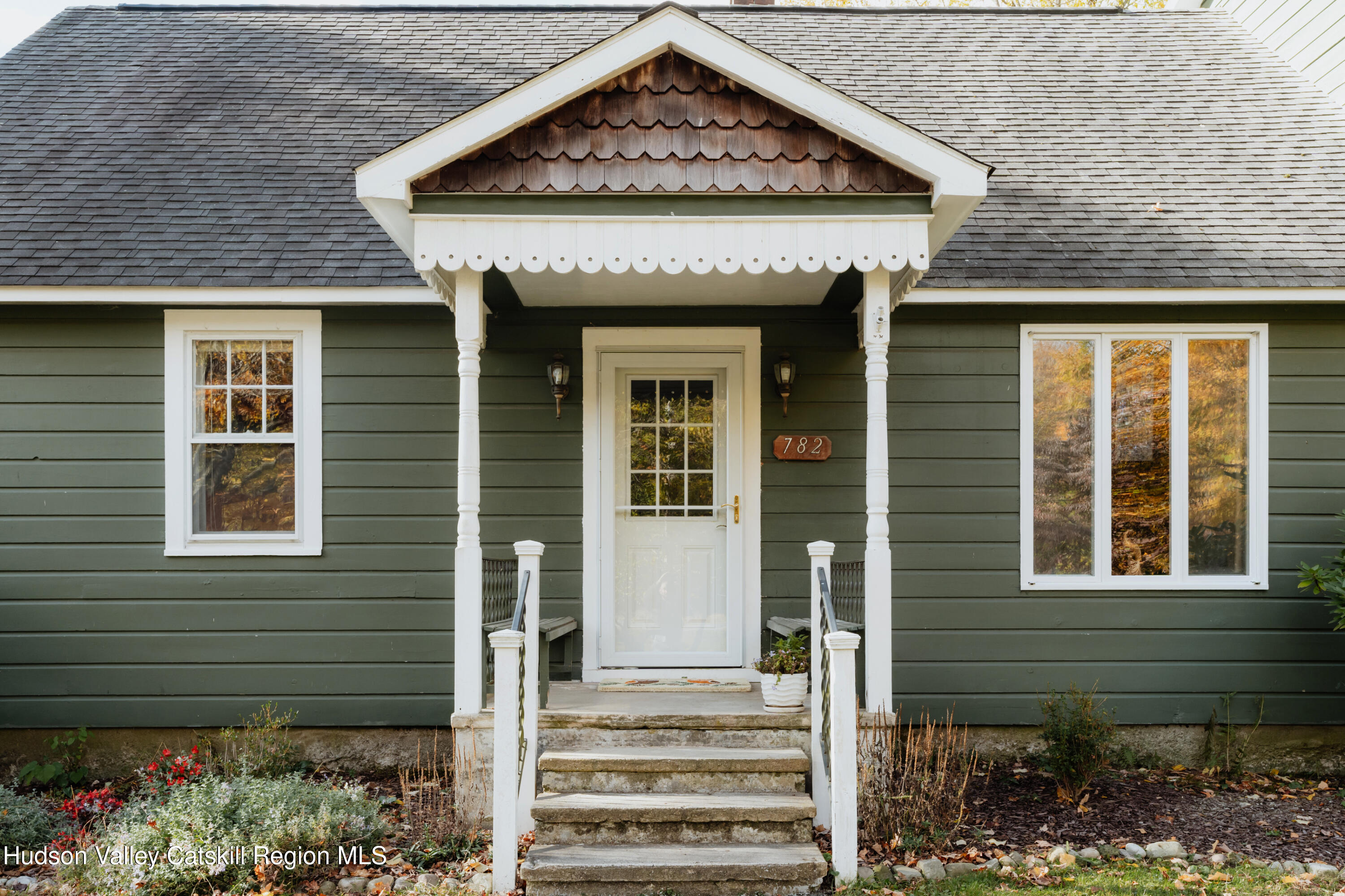 782-784 Jackson Corners Road Red Hook, NY 12571 - Photo 9 of 63 a front view of a house with a yard