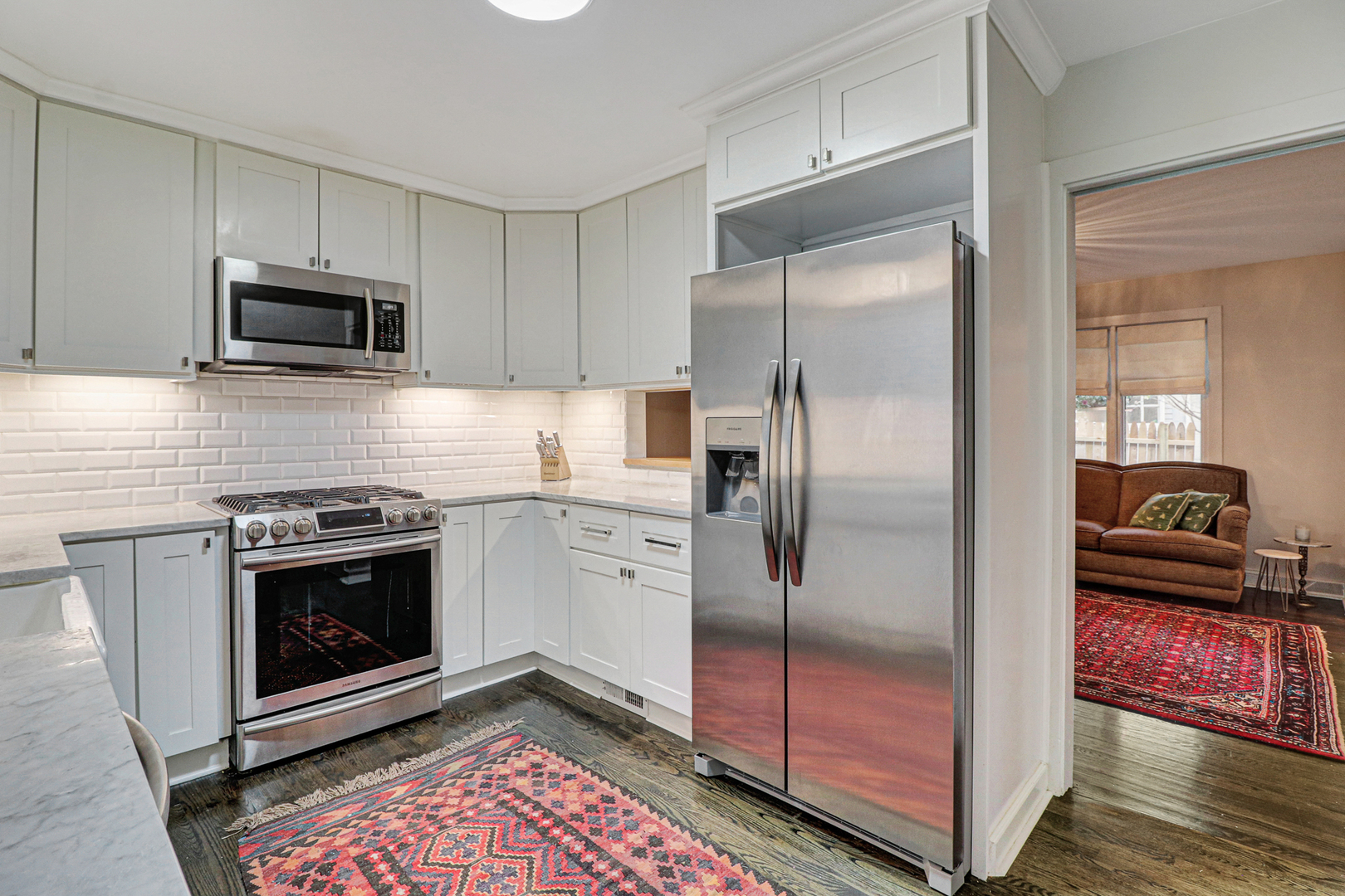 34 Washington Road, Unit 2 Lake Forest, IL 60045 - Photo 5 of 25 a kitchen with stainless steel appliances granite countertop a stove a refrigerator and a sink