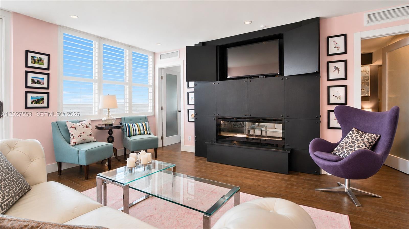 100 Lincoln Road, Unit 533 Miami Beach, FL 33139 - Photo 3 of 26 a living room with furniture and a fireplace