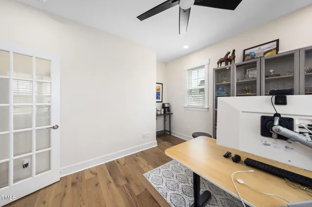 a bed sitting in a bedroom next to a window