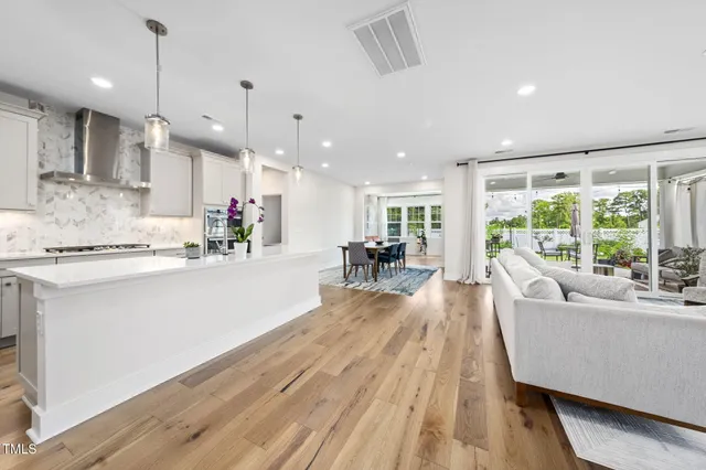 a workspace with wooden floor and a window