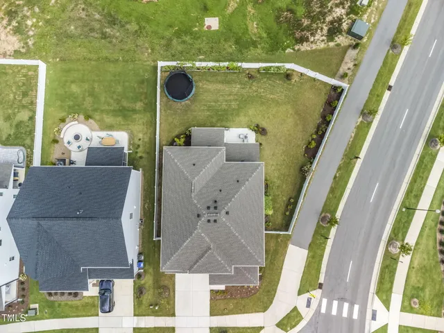 an aerial view of a house with a swimming pool