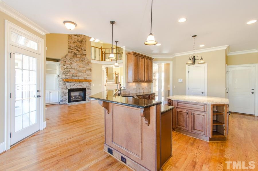 305 Woodlief Farm Road Rolesville, NC 27571 - Photo 11 of 25 Natural gas, gas cook top, wall oven, SS appliances, hardwood floors, under cabinet lighting Kitchen open and bright