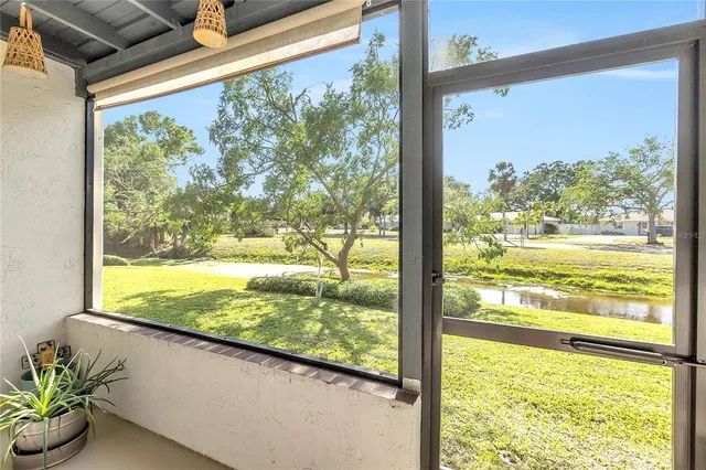 a view of a lake with a yard