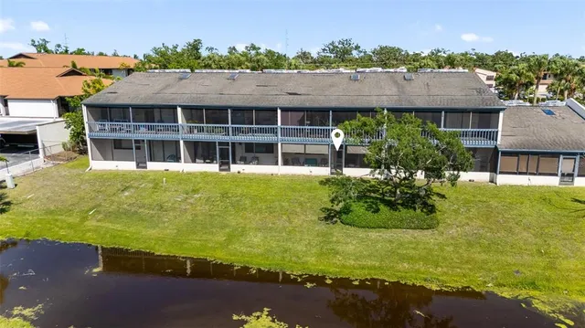 an aerial view of residential houses with yard