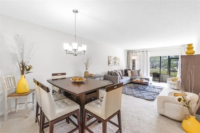 a view of a livingroom with furniture and window
