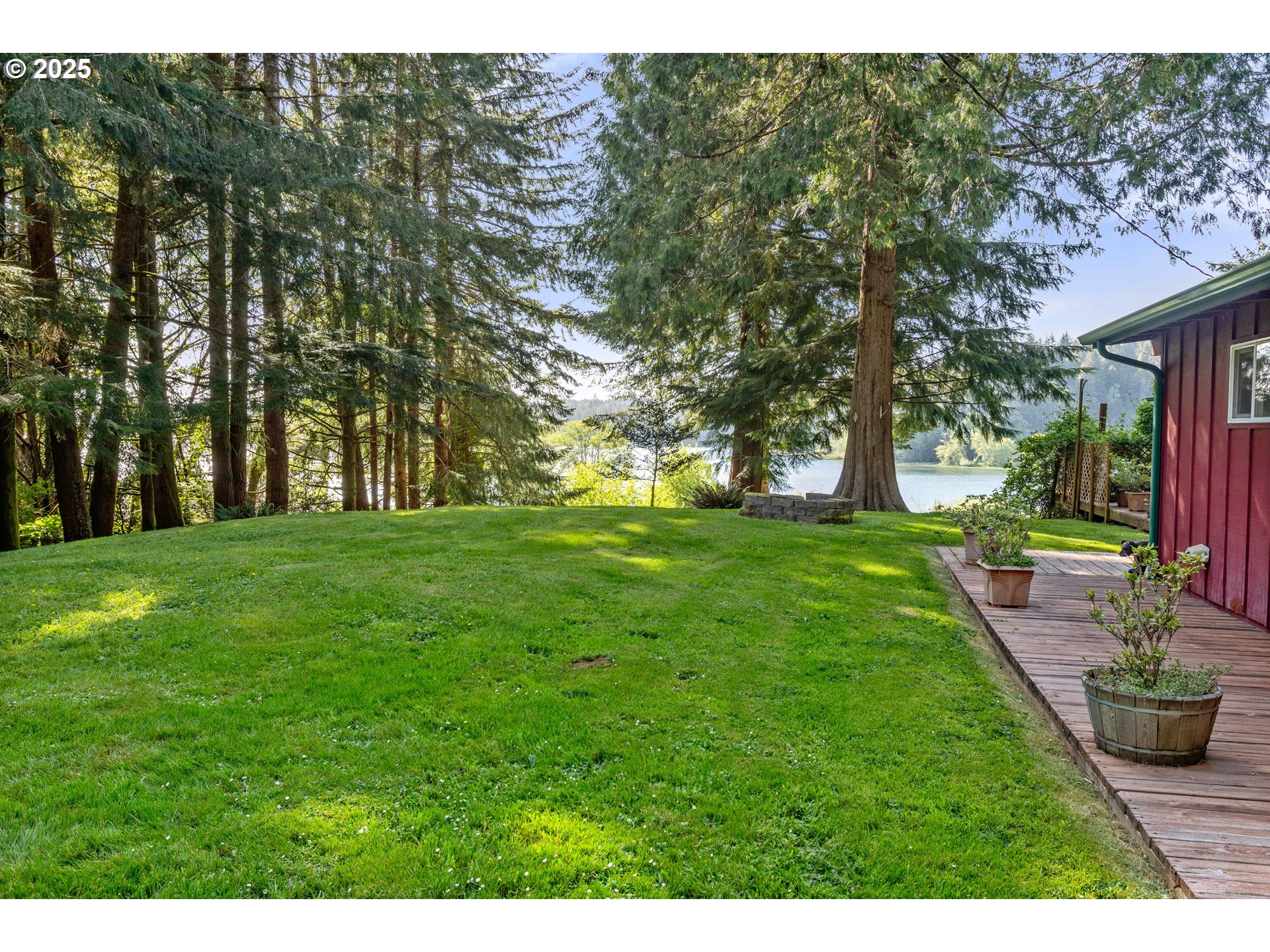 83049 Siltcoos Station Road Westlake, OR 97493 - Photo 14 of 48 a view of grassy field with benches