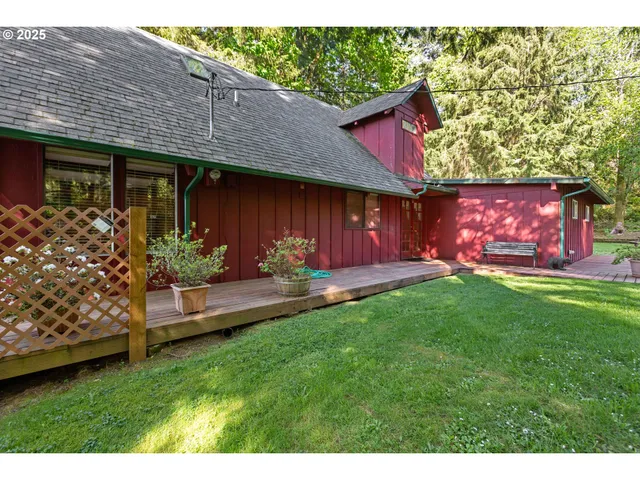a backyard of a house with yard and outdoor seating
