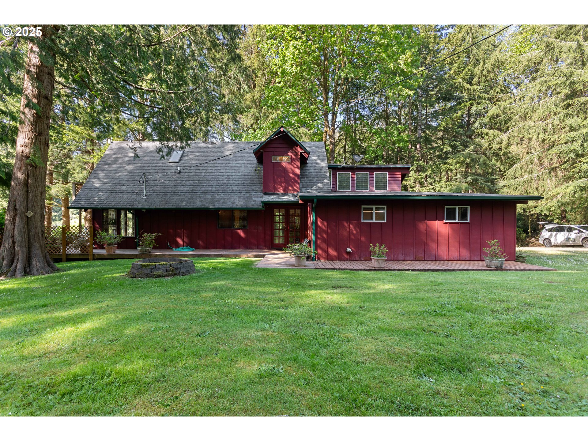 83049 Siltcoos Station Road Westlake, OR 97493 - Photo 17 of 48 a view of backyard with outdoor seating and green space