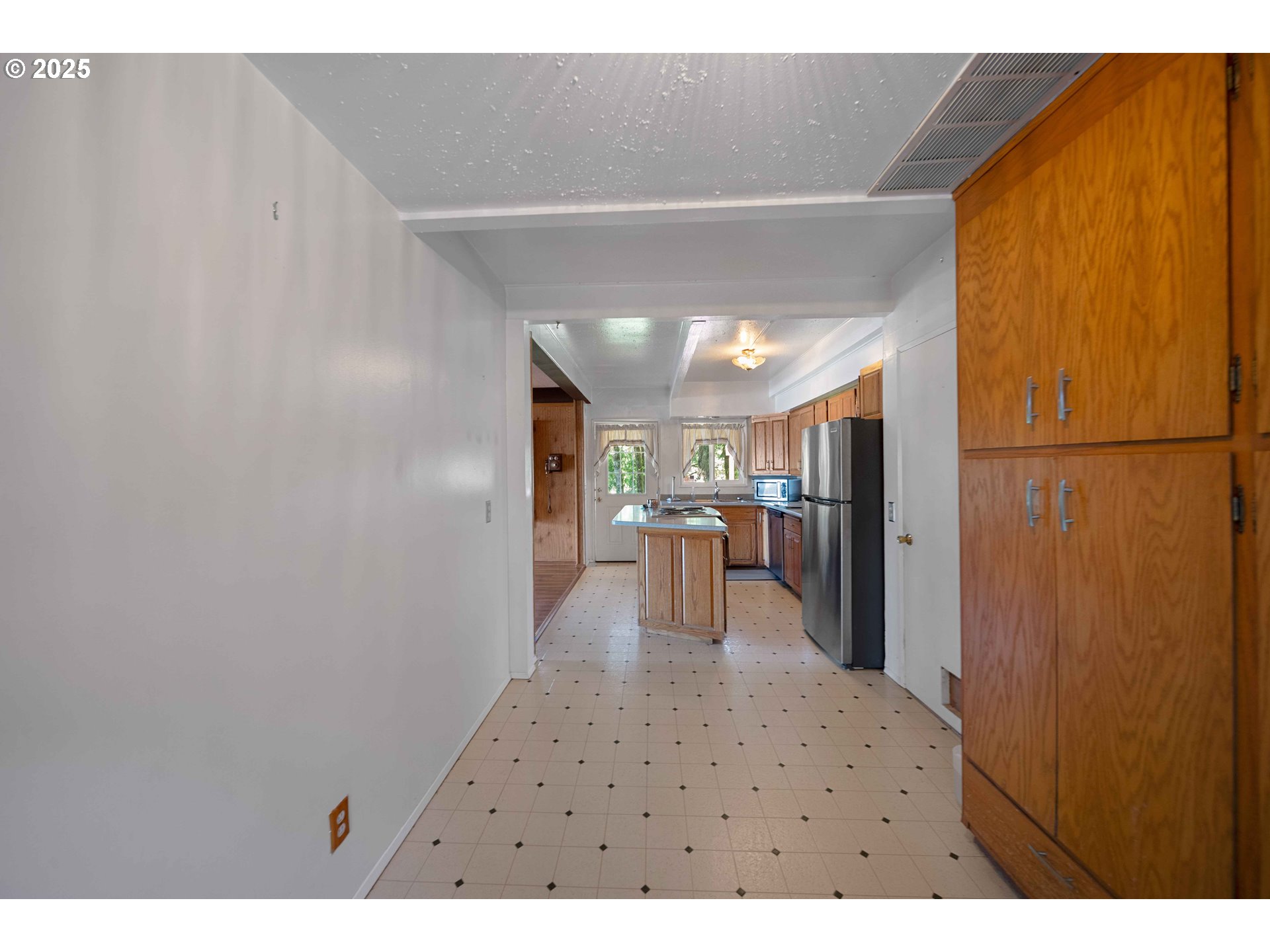 83049 Siltcoos Station Road Westlake, OR 97493 - Photo 18 of 48 a view of dining room with wooden floor