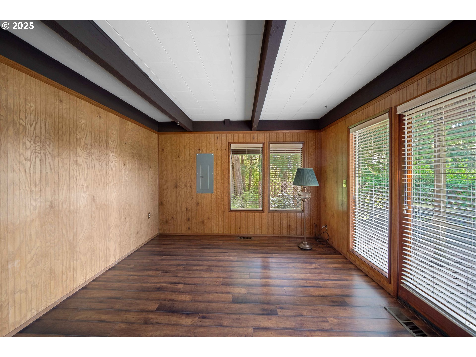 83049 Siltcoos Station Road Westlake, OR 97493 - Photo 26 of 48 a view of an empty room with wooden floor and a window