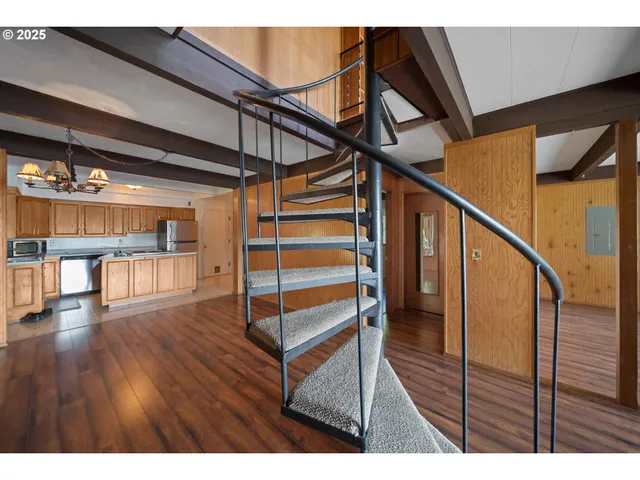 a view of an empty room with stairs