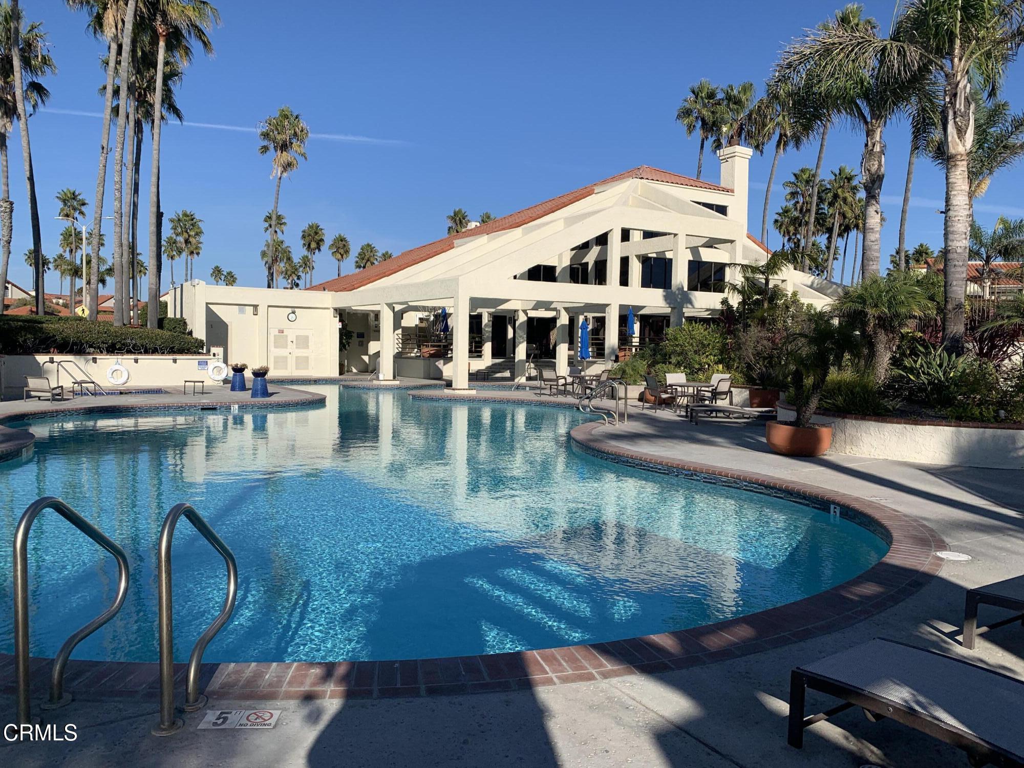 a view of a swimming pool with a lounge chairs