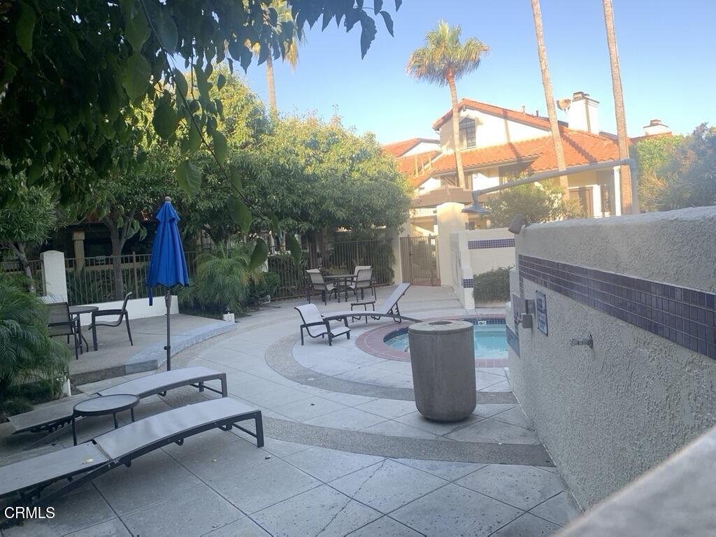 4455 Antigua Way Oxnard, CA 93035 - Photo 12 of 26 a view of a patio with table and chairs potted plants