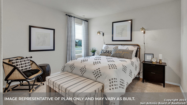 1008 Village Run Seguin, TX 78155 - Photo 24 of 39 a bedroom with a bed and a chair