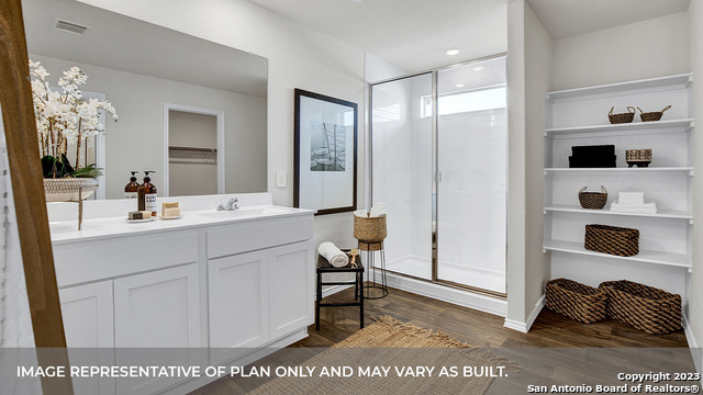 1008 Village Run Seguin, TX 78155 - Photo 31 of 39 a bathroom with a sink and a mirror