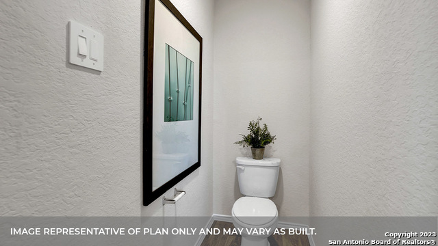 1008 Village Run Seguin, TX 78155 - Photo 32 of 39 a bathroom with a toilet and a potted plant