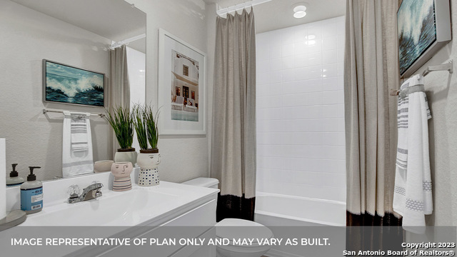 1008 Village Run Seguin, TX 78155 - Photo 6 of 39 a bathroom with a sink a mirror and shower