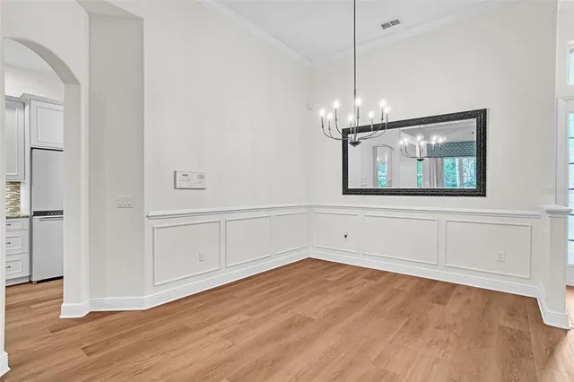 a view of a livingroom with a ceiling fan and window