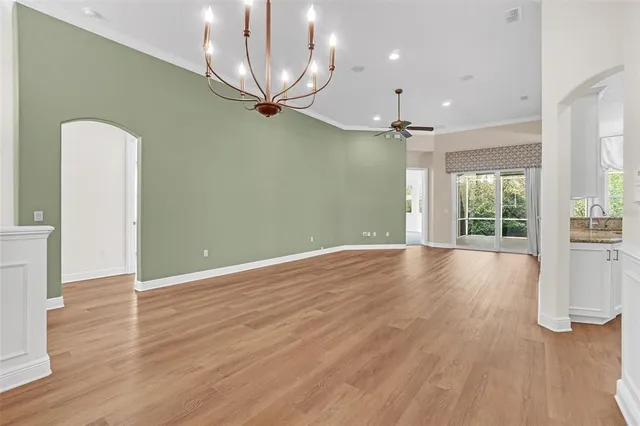 a bathroom with a granite countertop sink a large mirror and a vanity