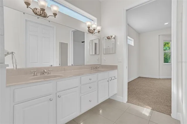 a view of a room with window and a ceiling fan