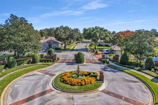 a kitchen with granite countertop kitchen island stainless steel appliances a sink stove and cabinets
