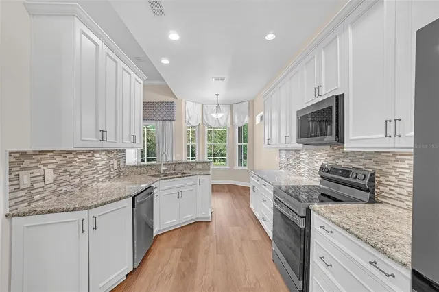a view of a room with window and wooden floor
