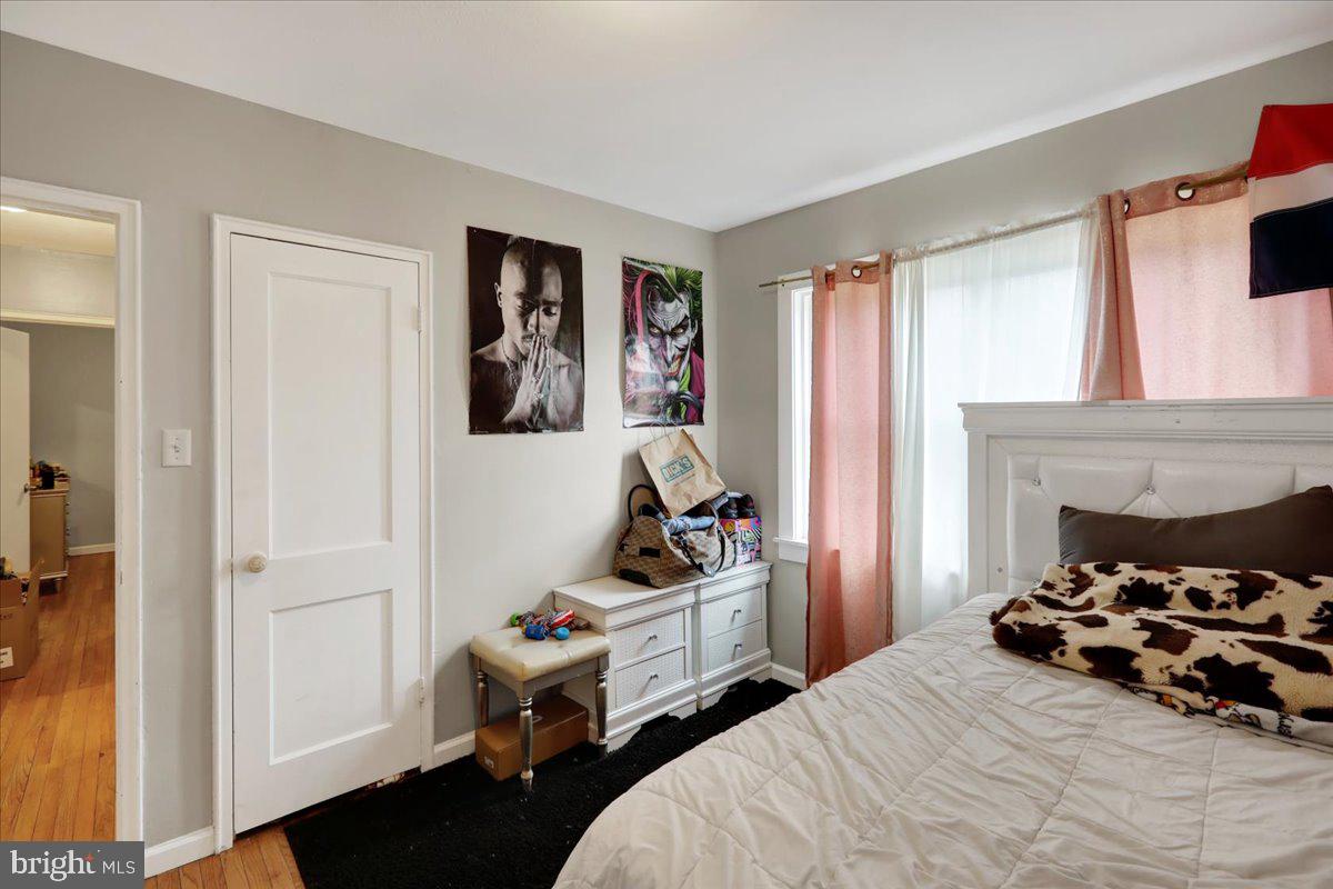 108 Gerald Avenue Reading, PA 19607 - Photo 11 of 25 a bedroom with a bed and wooden floor