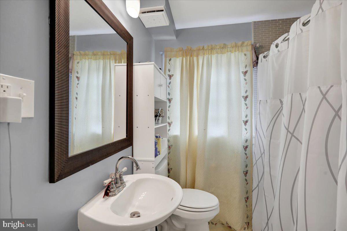 108 Gerald Avenue Reading, PA 19607 - Photo 12 of 25 a bathroom with a sink a toilet and shower