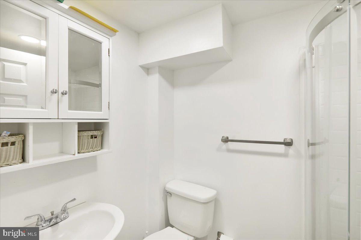 108 Gerald Avenue Reading, PA 19607 - Photo 16 of 25 a white toilet sitting next to a bathroom sink