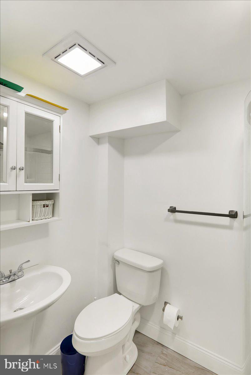 108 Gerald Avenue Reading, PA 19607 - Photo 17 of 25 a white toilet sitting next to a bathroom sink