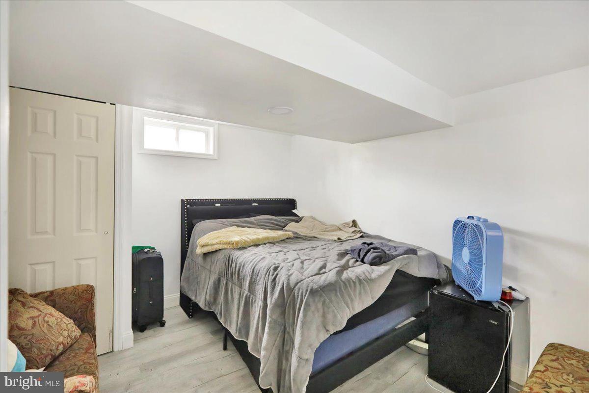 108 Gerald Avenue Reading, PA 19607 - Photo 23 of 25 a bedroom with a bed and wooden floor