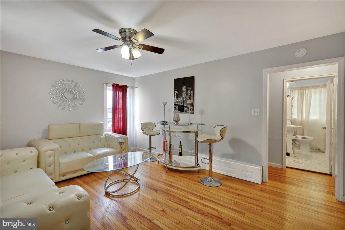 108 Gerald Avenue Reading, PA 19607 - Photo 3 of 25 a living room with furniture and a wooden floor