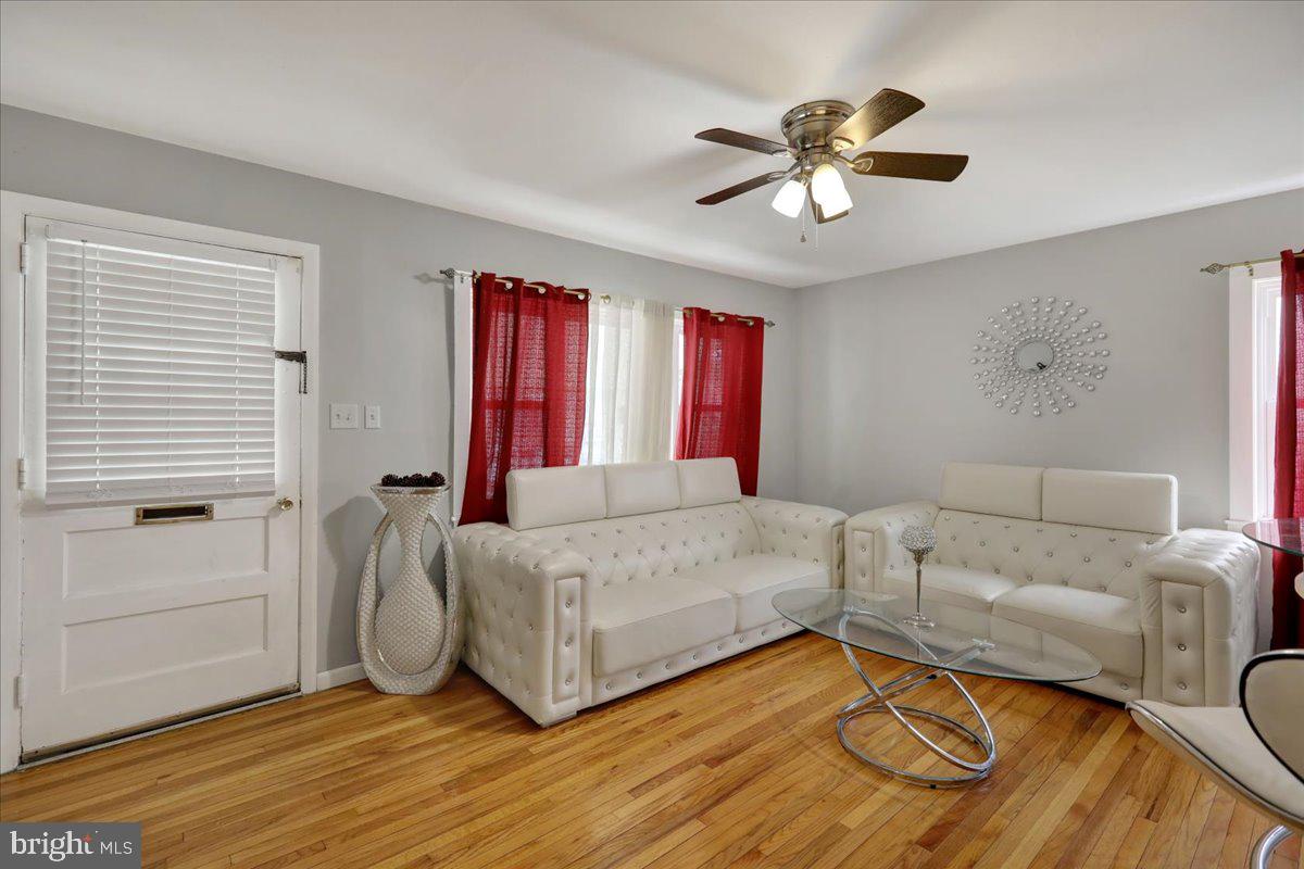 108 Gerald Avenue Reading, PA 19607 - Photo 4 of 25 a living room with furniture and a chandelier