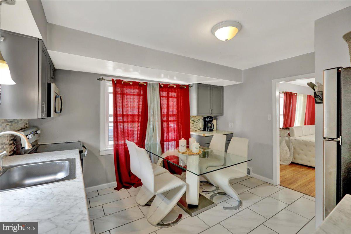 108 Gerald Avenue Reading, PA 19607 - Photo 6 of 25 a living room with furniture and a flat screen tv