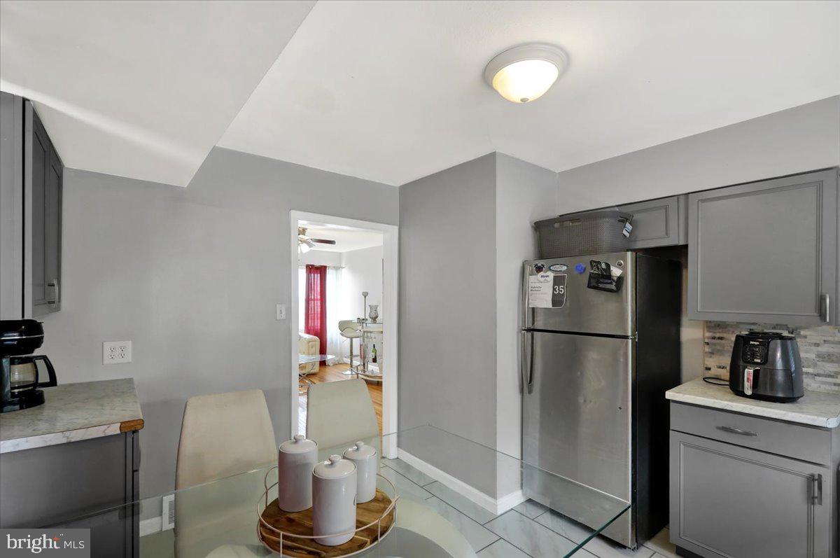 108 Gerald Avenue Reading, PA 19607 - Photo 7 of 25 a kitchen with a refrigerator a stove top oven a sink and dishwasher