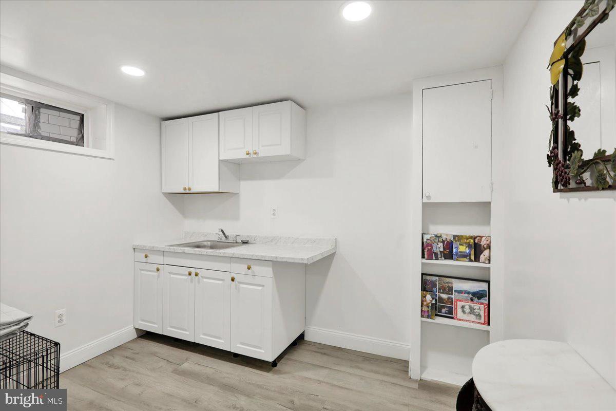 108 Gerald Avenue Reading, PA 19607 - Photo 10 of 25 a kitchen with stainless steel appliances a sink and a stove top oven