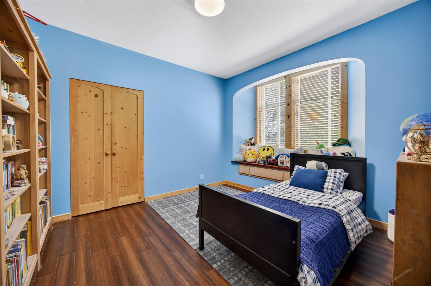 3940 Bannister Road Fair Oaks, CA 95628 - Photo 18 of 84 a bedroom with a bed and wooden floor