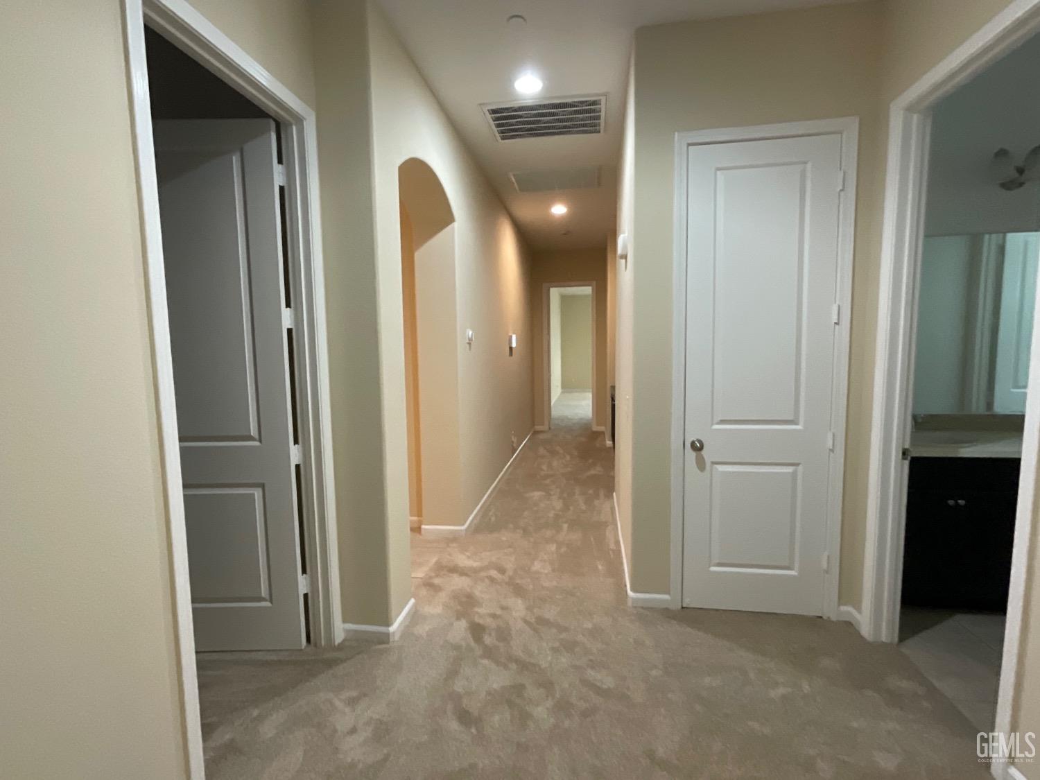 Undisclosed Address Bakersfield, CA 93314 - Photo 22 of 31 wooden view of a hallway with closet and a bathroom