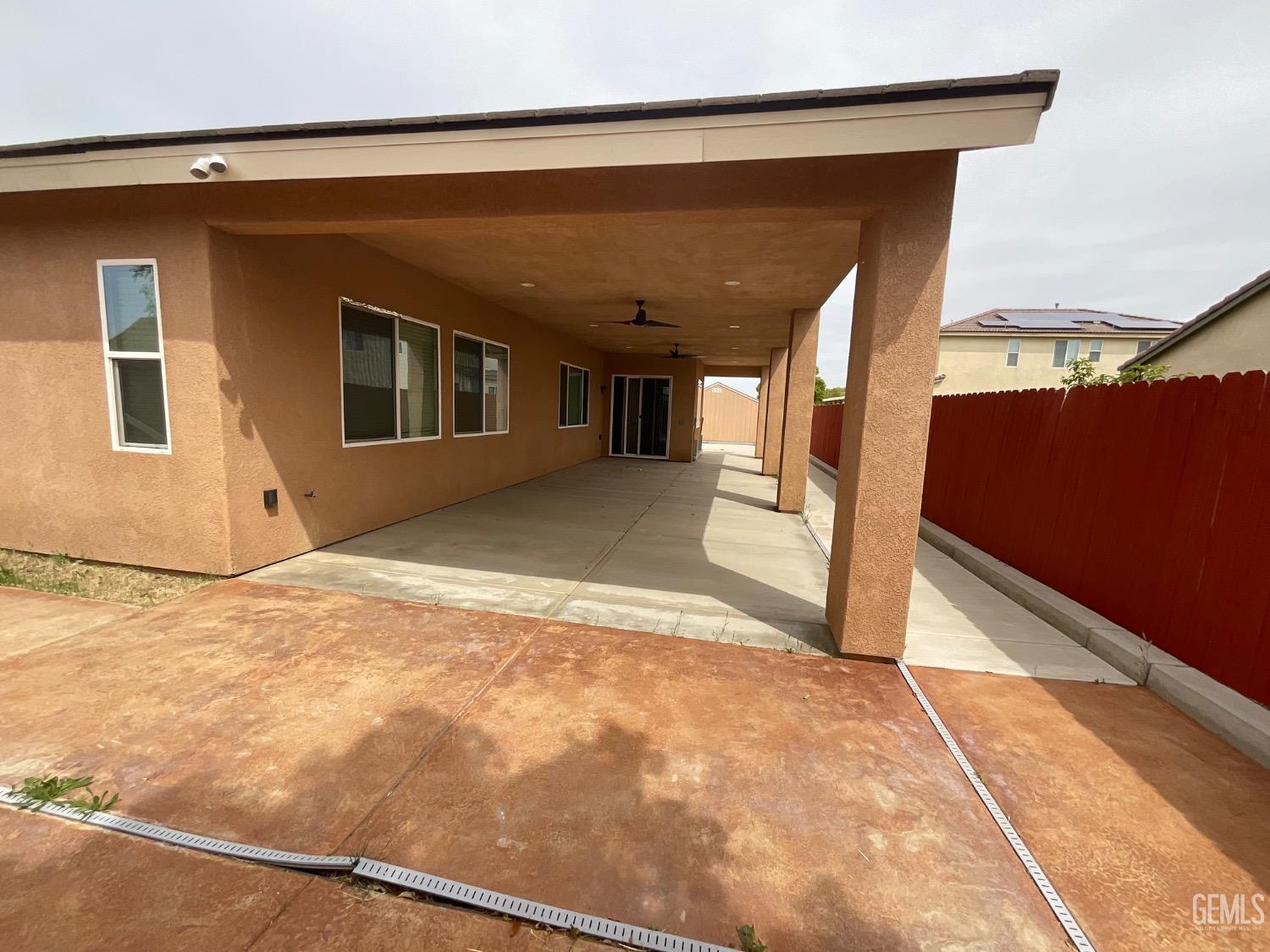 Undisclosed Address Bakersfield, CA 93314 - Photo 27 of 31 a view of a house with a backyard