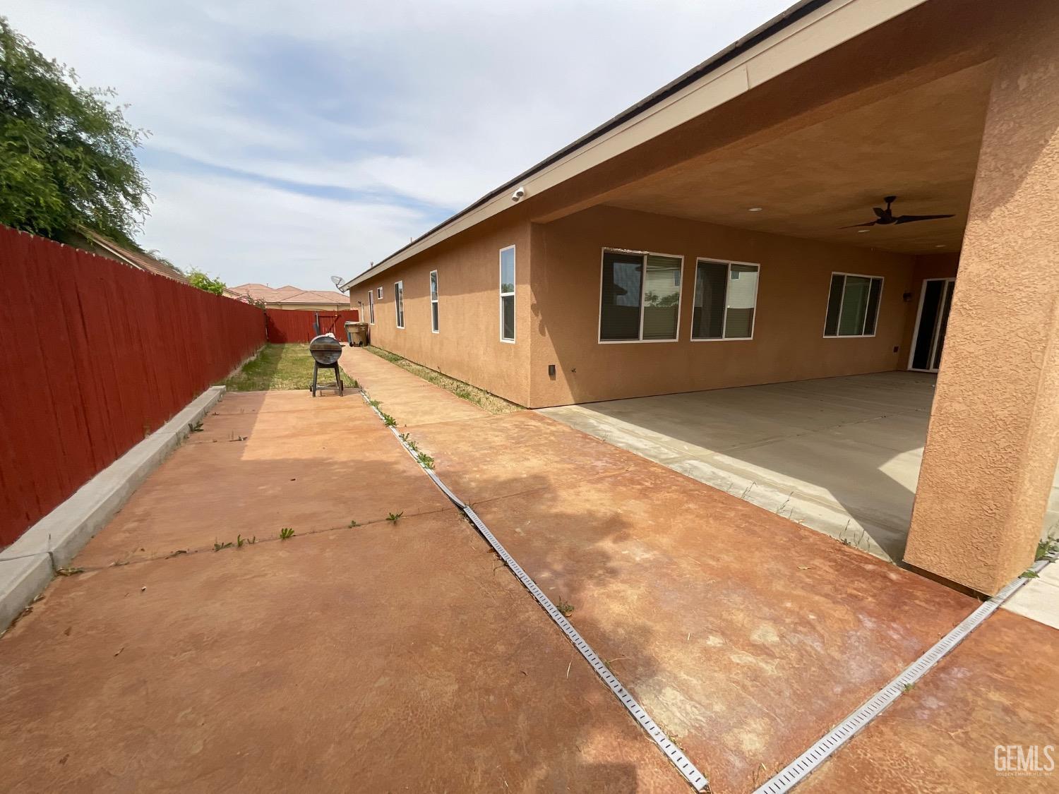 Undisclosed Address Bakersfield, CA 93314 - Photo 30 of 31 a view of a house with a backyard